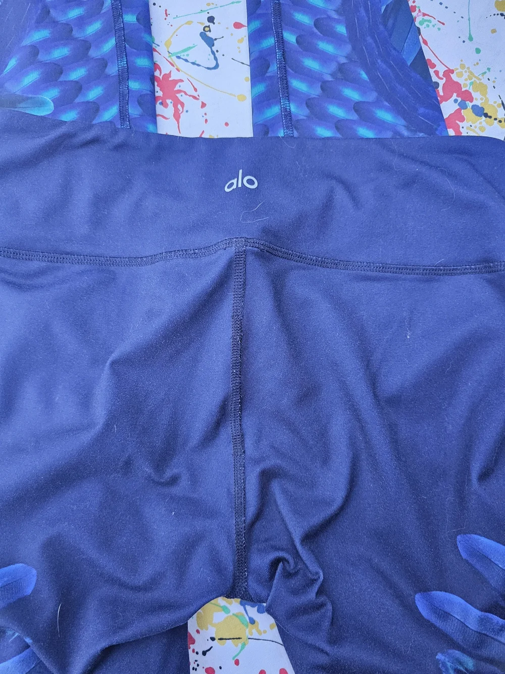ALO Yoga Navy Leggings with Vibrant Blue Feather Print